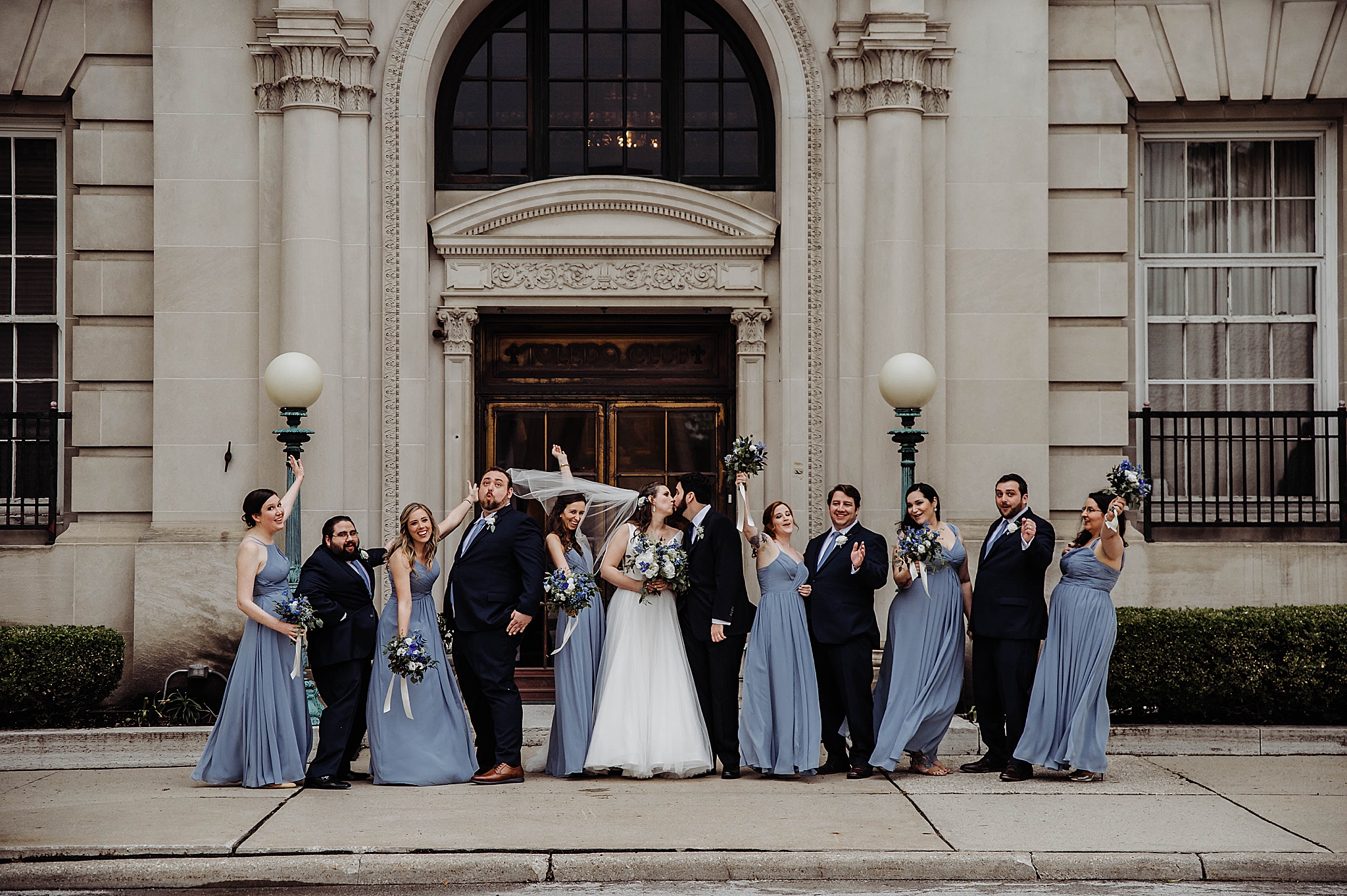 bridal party cheers outside Toledo Club