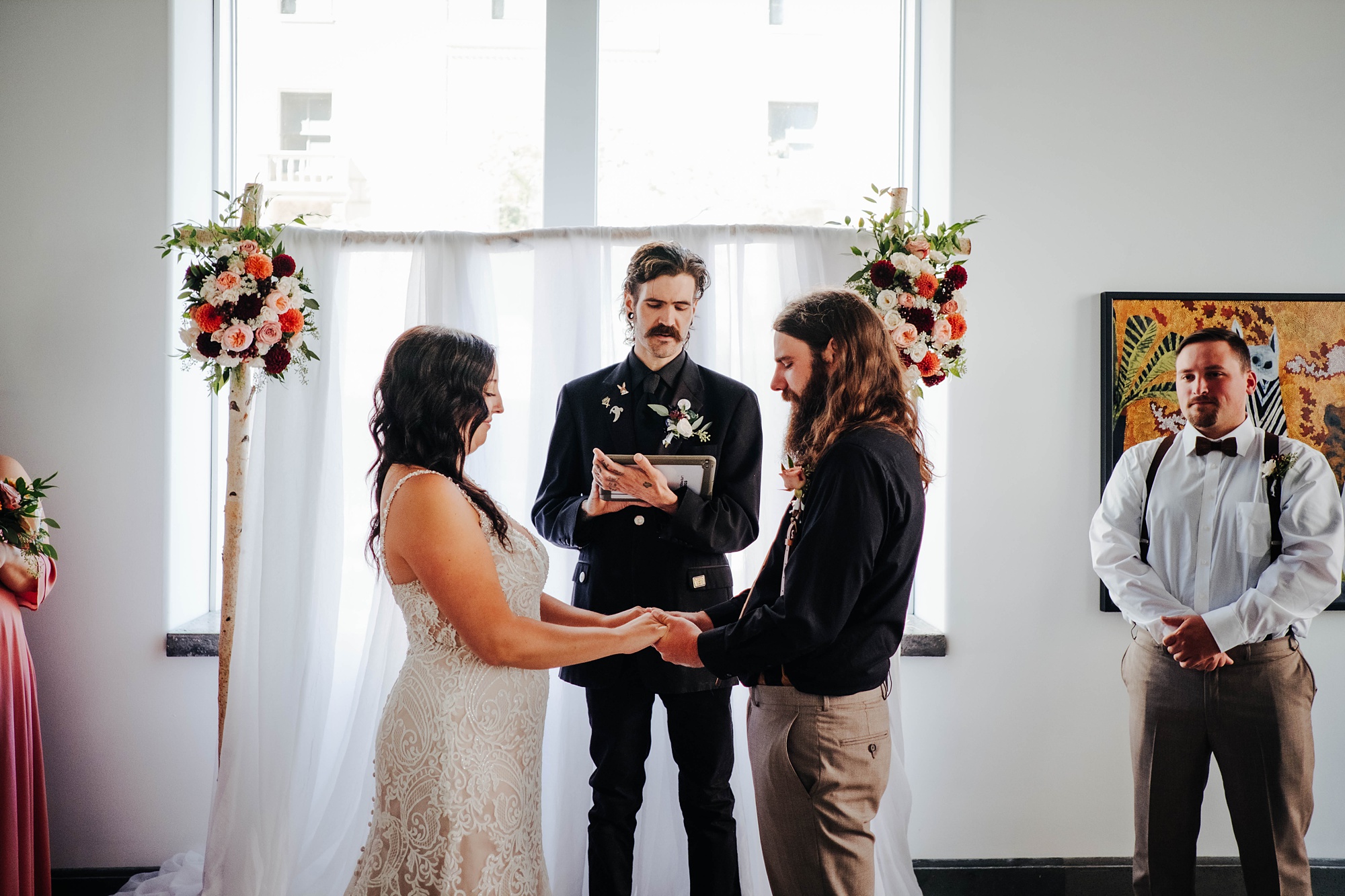 bride and groom exchange vows at Registry bistro 
